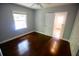 Bright bedroom featuring a window, hardwood floors and a ceiling fan at 1624 Beatie Ave, Atlanta, GA 30310