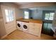 Kitchen featuring a butcher block island, a washer, a dryer and tiled flooring at 1624 Beatie Ave, Atlanta, GA 30310