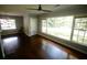 Bright living room with hardwood floors, ceiling fan, and a large picture window at 1624 Beatie Ave, Atlanta, GA 30310