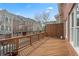 Outdoor wooden deck with railing, offering a view of the neighborhood at 2620 Milford Ln, Alpharetta, GA 30009