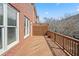 Wooden deck with railing attached to a brick building, providing outdoor space at 2620 Milford Ln, Alpharetta, GA 30009