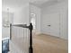 Bright hallway with carpet flooring, white walls, and staircase overlooking the front door at 2620 Milford Ln, Alpharetta, GA 30009