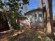 View of the back exterior of the home with partial brick and siding at 5169 Oxbow Rd, Stone Mountain, GA 30087