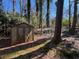 Backyard showing the shed in the wooded yard at 5169 Oxbow Rd, Stone Mountain, GA 30087