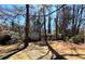 Two-story home with brick and siding exterior, nestled in a wooded lot with mature trees at 5169 Oxbow Rd, Stone Mountain, GA 30087