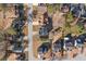 Neighborhood aerial view featuring well-maintained homes, tree coverage and a quiet street at 826 Shore Dr, Lithonia, GA 30058