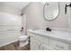 Bright bathroom features tub and shower combination with modern fixtures and stylish vanity at 826 Shore Dr, Lithonia, GA 30058