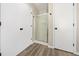 Bathroom area showing large white closets and a shower with glass doors at 826 Shore Dr, Lithonia, GA 30058