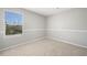 Bedroom features carpeted floors and large window providing natural light at 826 Shore Dr, Lithonia, GA 30058