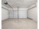 Spacious two car garage with automatic door openers and a concrete floor at 826 Shore Dr, Lithonia, GA 30058