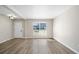 Living area featuring modern flooring, fresh paint, and natural light from the window with a front-door view at 826 Shore Dr, Lithonia, GA 30058