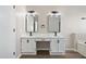 Main bathroom featuring new double sinks with granite counters and modern black accents at 826 Shore Dr, Lithonia, GA 30058