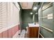 Stylish bathroom with a modern vanity, decorative floor tiles, a shower with curtain, and unique ladder decoration at 1015 Michigan Nw Ave, Atlanta, GA 30314
