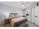 Cozy bedroom with a comfortable bed, a ceiling fan, a desk, and shelves, creating a relaxing atmosphere at 1015 Michigan Nw Ave, Atlanta, GA 30314