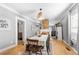 Cozy dining area featuring hardwood floors and view of the living room and updated kitchen at 1015 Michigan Nw Ave, Atlanta, GA 30314