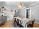 Warm dining area with a large table, modern lighting, and access to the updated kitchen at 1015 Michigan Nw Ave, Atlanta, GA 30314