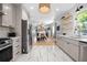 Bright kitchen featuring stainless steel appliances, white cabinetry, and an open concept layout at 1015 Michigan Nw Ave, Atlanta, GA 30314