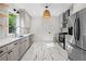 Bright, updated kitchen featuring stainless steel appliances, shaker cabinets and hexagon tile floors at 1015 Michigan Nw Ave, Atlanta, GA 30314
