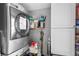 Functional laundry room with a stacked washer and dryer and ample storage cabinets at 1015 Michigan Nw Ave, Atlanta, GA 30314