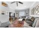 Bright and cozy living room features hardwood floors, a ceiling fan and comfortable seating at 1015 Michigan Nw Ave, Atlanta, GA 30314
