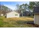 Large fenced backyard with ample space and mature trees at 1107 Sanfords Walk, Tucker, GA 30084