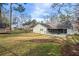 Spacious backyard featuring fence, storage shed, and covered patio at 1107 Sanfords Walk, Tucker, GA 30084