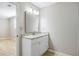 Bathroom featuring a granite countertop vanity with a large mirror and ample cabinet space at 1107 Sanfords Walk, Tucker, GA 30084