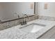 Bathroom vanity with granite countertops, chrome faucet, and white basin at 1107 Sanfords Walk, Tucker, GA 30084