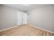 Cozy bedroom featuring wood-look flooring and a classic white bi-fold closet door at 1107 Sanfords Walk, Tucker, GA 30084