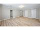 Large bedroom with wood floors, ample closet space, and neutral paint at 1107 Sanfords Walk, Tucker, GA 30084