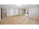 Bedroom featuring light wood floors, neutral walls and a sliding glass door leading to the screened porch at 1107 Sanfords Walk, Tucker, GA 30084