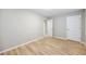 Bedroom with wood-look floors, neutral paint, and closet at 1107 Sanfords Walk, Tucker, GA 30084