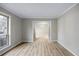 Open dining room area with wood floors and large window at 1107 Sanfords Walk, Tucker, GA 30084