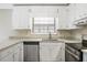 Close-up of kitchen with stainless steel appliances and granite counters at 1107 Sanfords Walk, Tucker, GA 30084