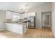 Bright kitchen with white cabinets, stainless steel appliances, and granite countertops at 1107 Sanfords Walk, Tucker, GA 30084