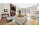 Comfortable living room with a stone fireplace and a view of the backyard at 1107 Sanfords Walk, Tucker, GA 30084