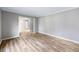Open living room area with wood floors at 1107 Sanfords Walk, Tucker, GA 30084