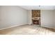 Open living room with wood floors and stone fireplace at 1107 Sanfords Walk, Tucker, GA 30084