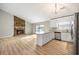 Open floor plan featuring a fireplace and a kitchen island at 1107 Sanfords Walk, Tucker, GA 30084