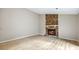 Living room showcases stone fireplace, neutral paint, and wood-look flooring at 1107 Sanfords Walk, Tucker, GA 30084