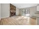 Living room with fireplace and sliding glass door access to the backyard at 1107 Sanfords Walk, Tucker, GA 30084