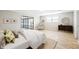 Serene main bedroom featuring wood floors, sliding glass doors to sunroom, and neutral decor at 1107 Sanfords Walk, Tucker, GA 30084
