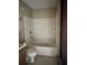 Bathroom featuring a tub with a shower at 13101 Waldrop Cv, Decatur, GA 30034