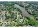 Neighborhood view of home near a pond surrounded by lush trees, creating a serene and private setting at 5080 Firelight Ln, Alpharetta, GA 30022