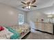 Comfortable bedroom with natural light and a vintage dresser, creating a serene atmosphere at 5080 Firelight Ln, Alpharetta, GA 30022