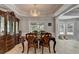 Elegant dining room featuring chandelier, detailed molding, and plenty of natural light for gracious dining at 5080 Firelight Ln, Alpharetta, GA 30022