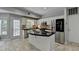 Renovated kitchen features stainless steel appliances, modern cabinets and functional island at 5080 Firelight Ln, Alpharetta, GA 30022