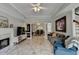 Open-concept living area showcasing tiled floors, fireplace, and seamless flow into the dining area at 5080 Firelight Ln, Alpharetta, GA 30022