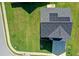 Aerial view showcasing a well-maintained lawn, a driveway, and solar panels on the roof at 6101 Providence Way, Union City, GA 30291