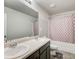 Clean bathroom features double sinks, a shower/tub, and modern fixtures at 6101 Providence Way, Union City, GA 30291